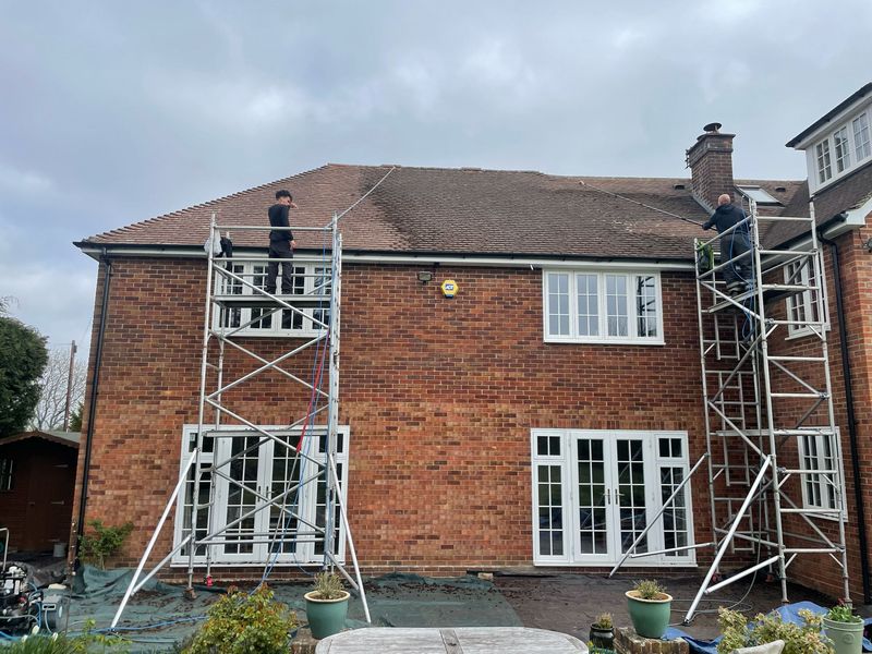 Roof cleaning carried out safely from scaffold towers by The Roof Moss Cleaners in Northampton